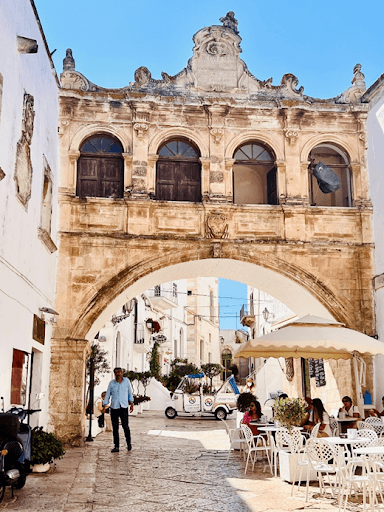 The Arch of Scoppa in Ostuni Italy with light blue skies 