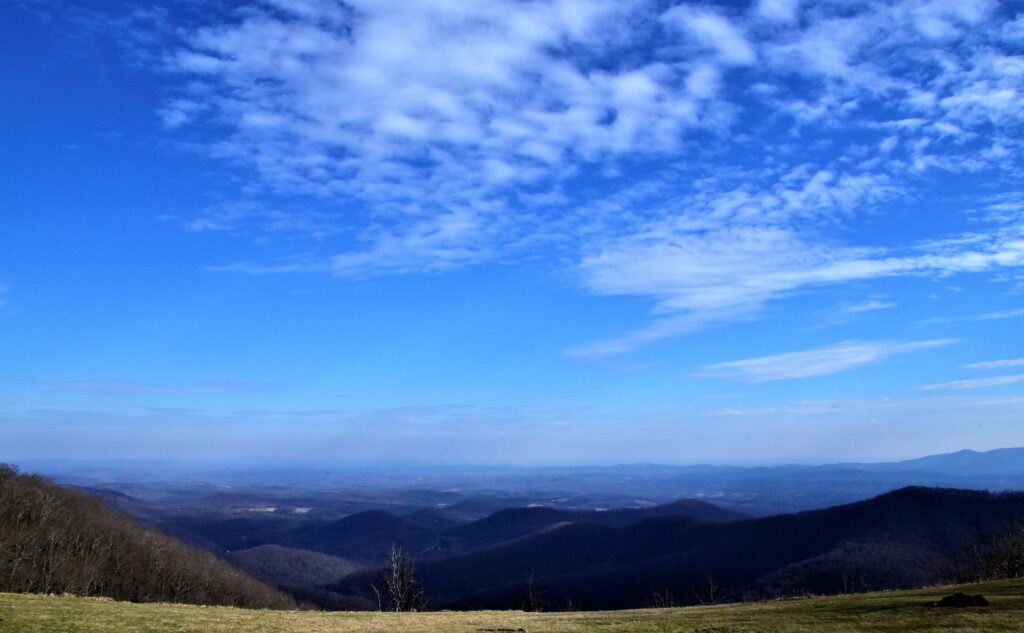 The sweeping view of the New River Valley nestled in the foothills of the Blue Ridge Mountains as seen from a Blue Ridge Parkway overlook.