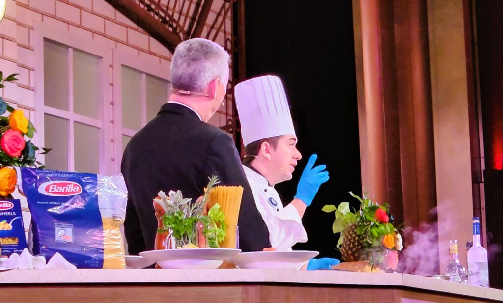 Chef Davide and Francesco creating a dish on stage of live show