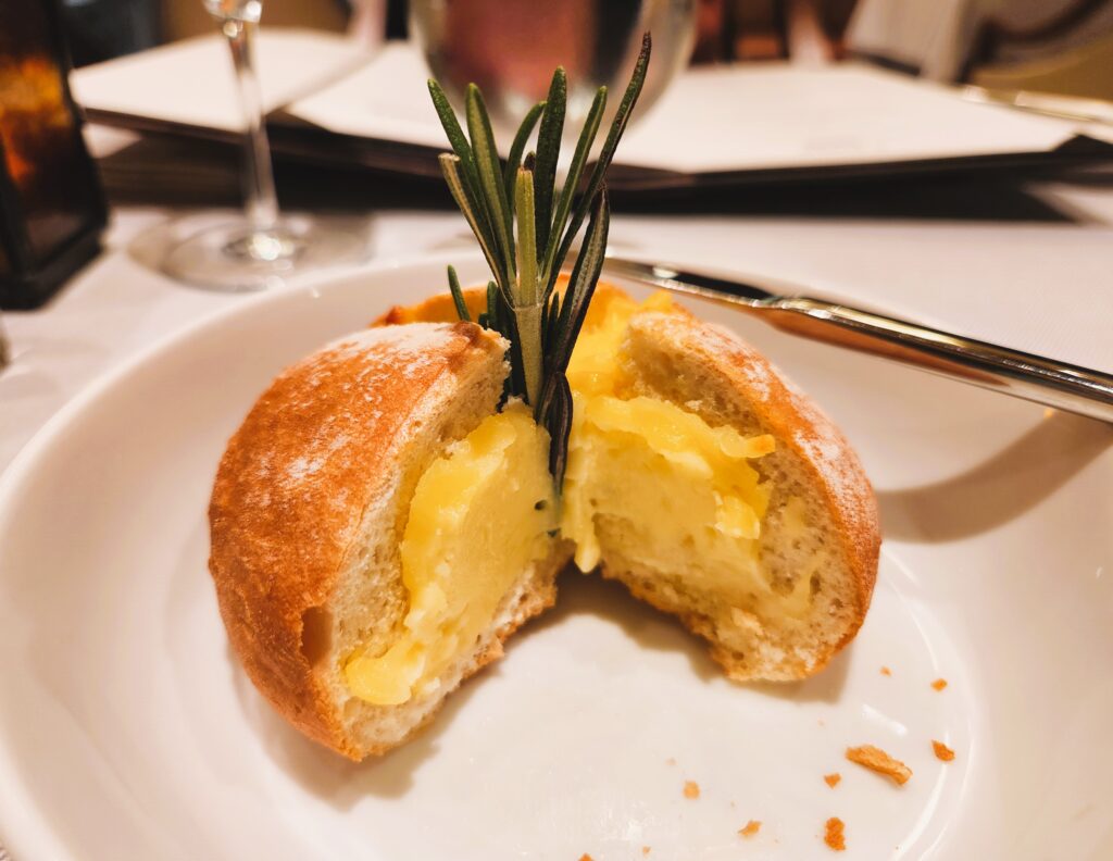 photos of pre-meal mozzarella-stuffed bread, appetizers, soups, desserts, and filet mignon 