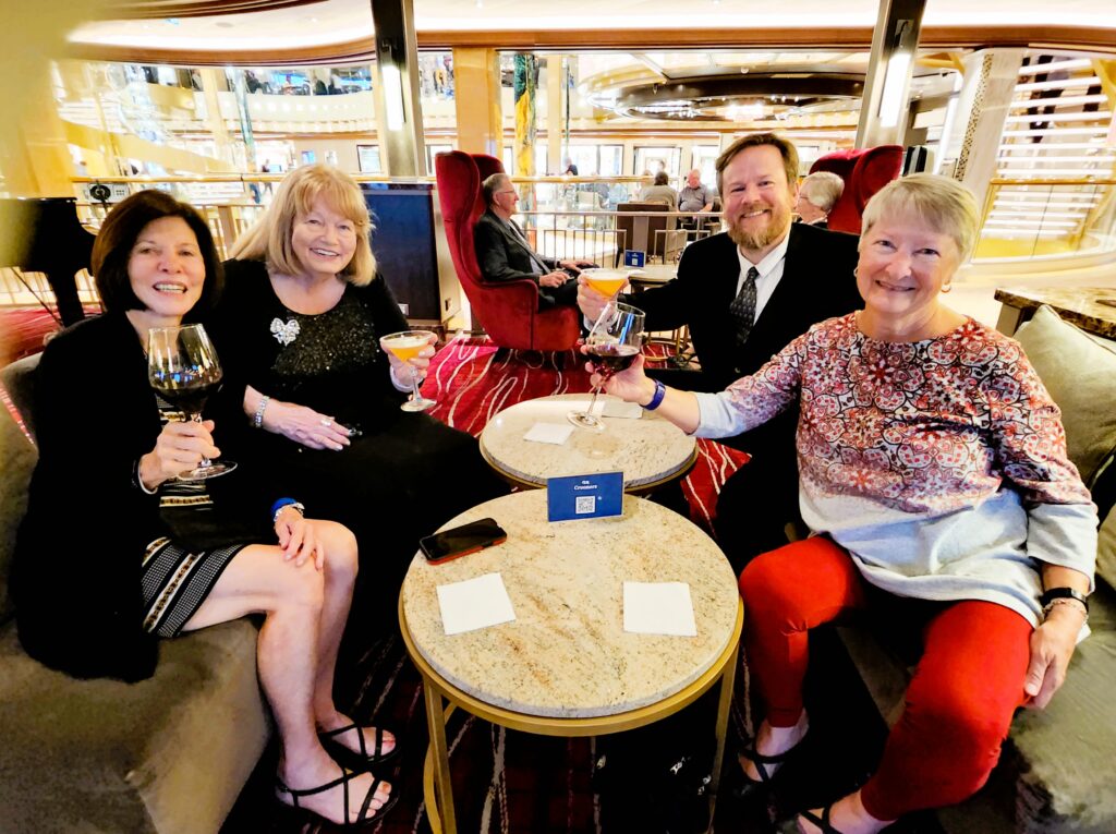 Four new-found friends toasting another wonderful time on the Discovery Princess Alaskan Cruise 