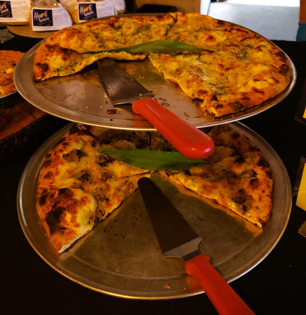 two tiers of pizza with whole ramps