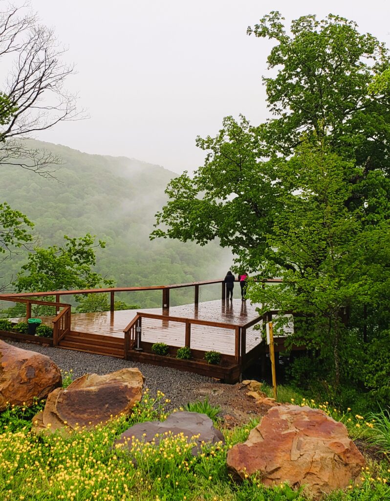 West Virginia 's Concho Overlook to see New River, in the rain, and a town below