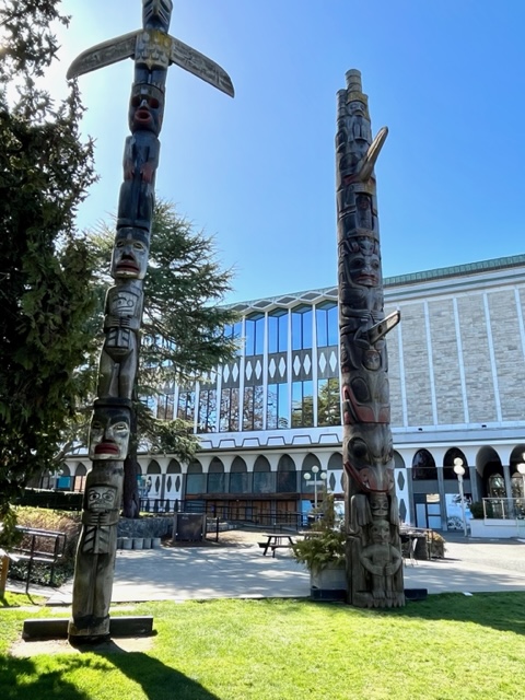 Totems outside the Royal BC Museum