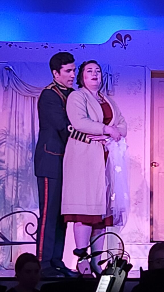 Man holding woman performing as Count and Countess Almaviva in the Marriage of Figaro