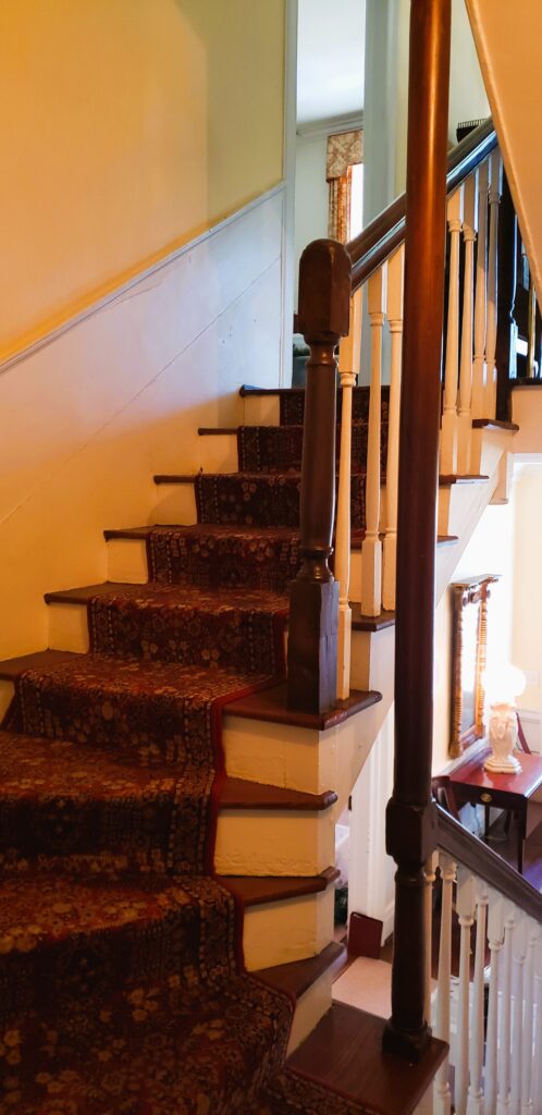 Curved stairway leading to second floor of Kaminski House