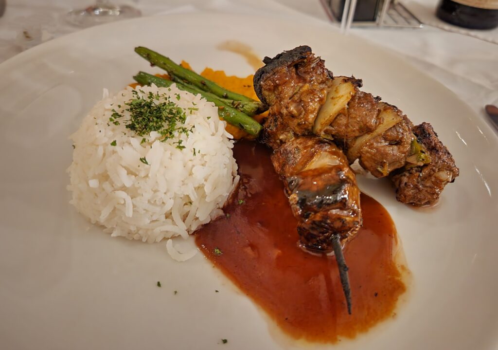 Grilled Oryx Kebabs on top of red wine jus with Basmati Rice, Butternut Puree, and asparagus for dinner at Bagatelle Kalahari Game Ranch.