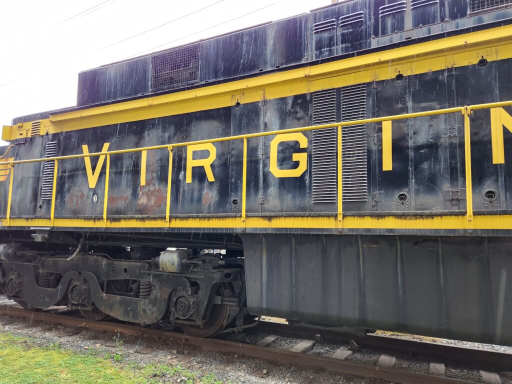 A beautiful blue train engine, with the word "Virginian" lettered the length of the engine.