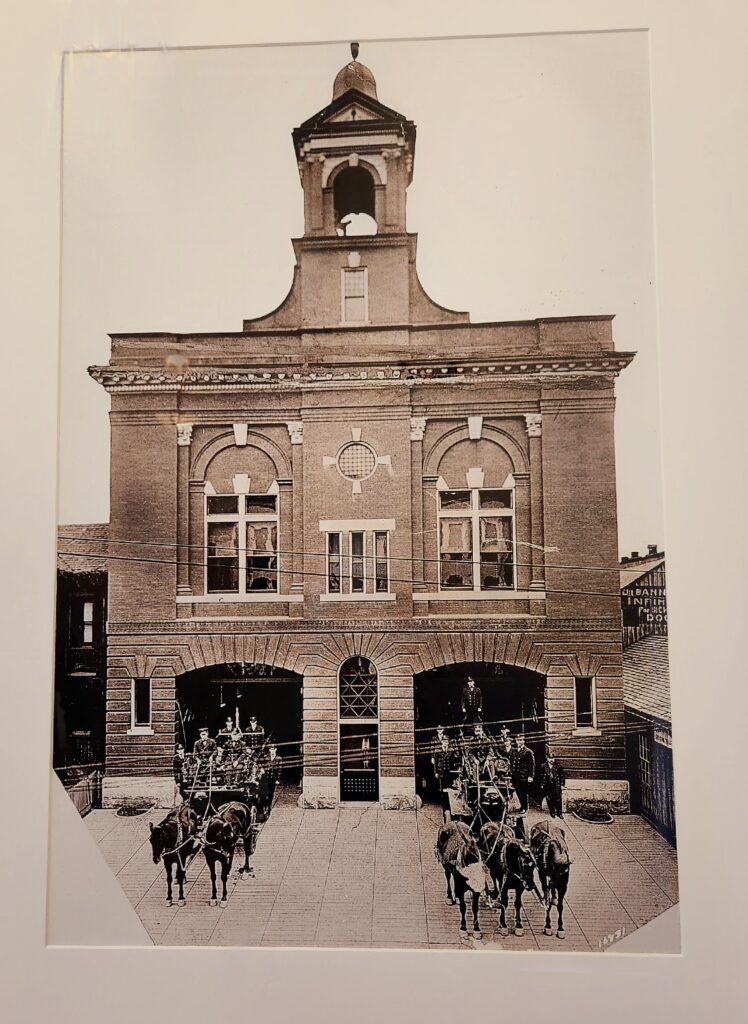 A red brick 1907 fire station with a bell tower on top in downtown Roanoke, but in the original black & white photograph!