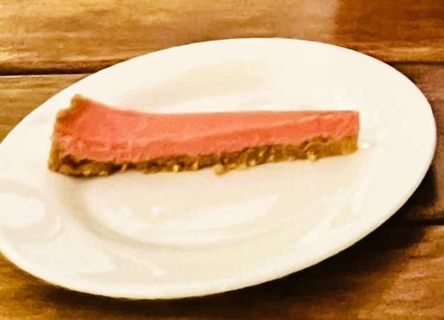 A slice of grapefruit pie on a plate.