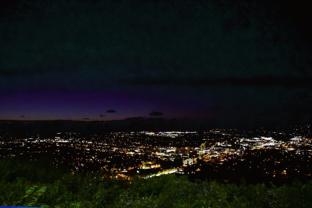 Roanoke, the Star City of the South, sparkles, while the sun sets in a photo from the top of Mill Mountain.