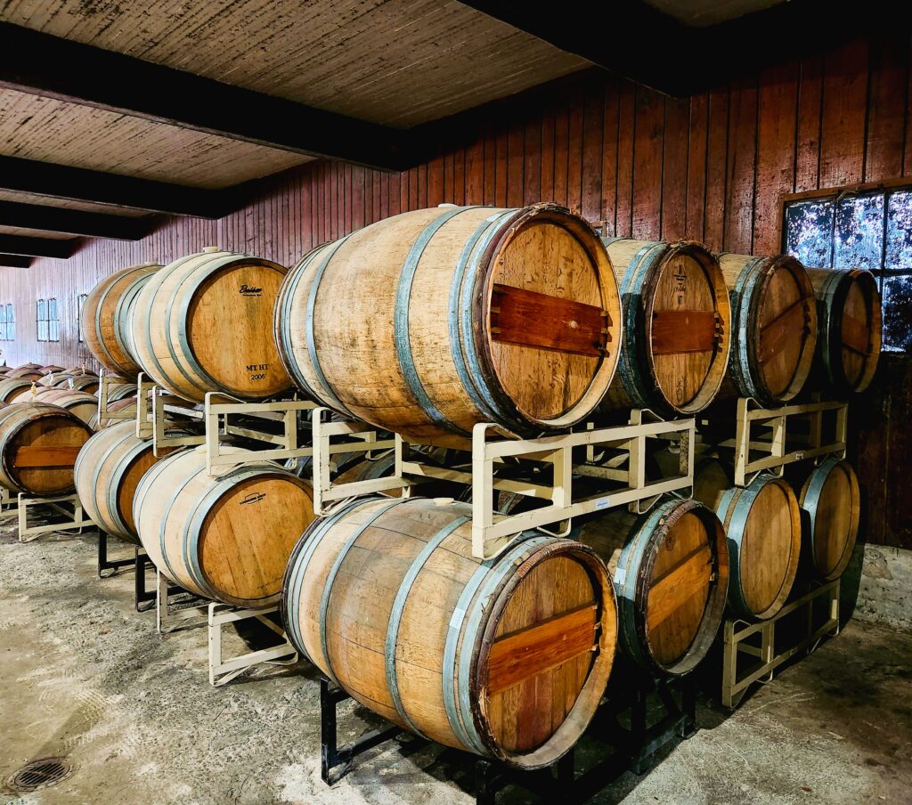 Yadkin Valley wine aging in barrels in the Grassy Creek old barn.