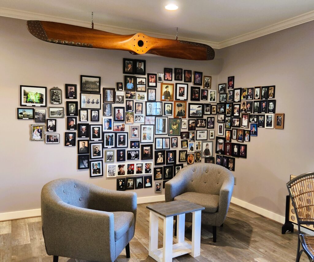 Yadkin Valley Wine maker at Haze Gray Vineyards, honors veterans with a wall of photos.
