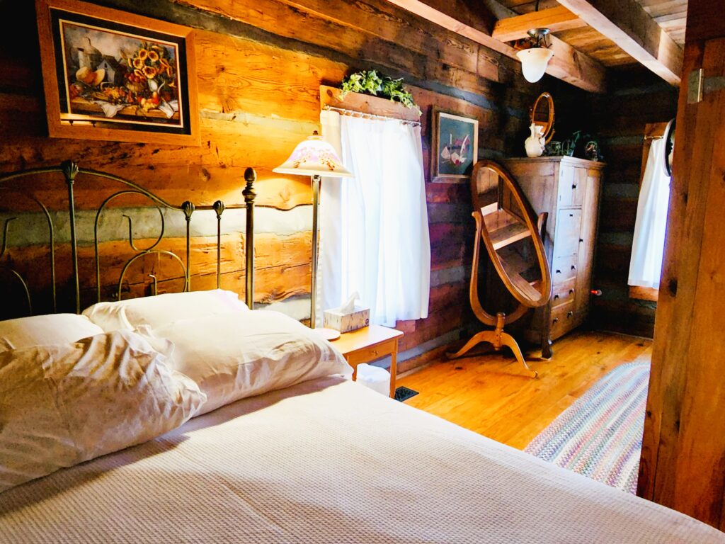 One of the bedrooms in the cozy log cabin.