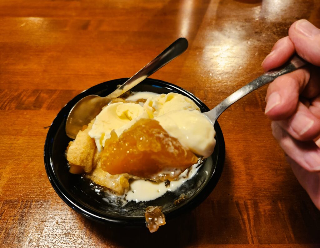 Apple Tart with ice cream and two spoons, ready for my eating pleasure!
