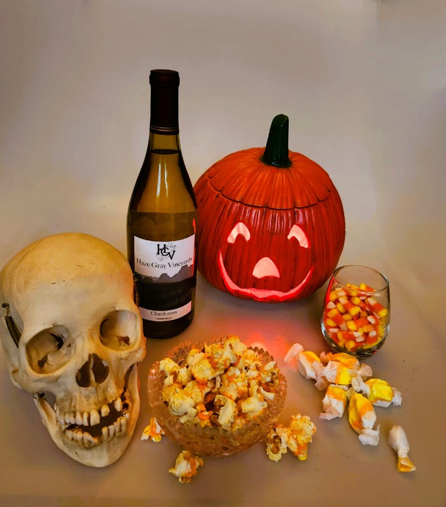 Halloween candy wine pairings with a bottle of Haze Gray Chardonnay and candy corn, candy corn drizzled popcorn, and candy corn flavored salt water taffy.