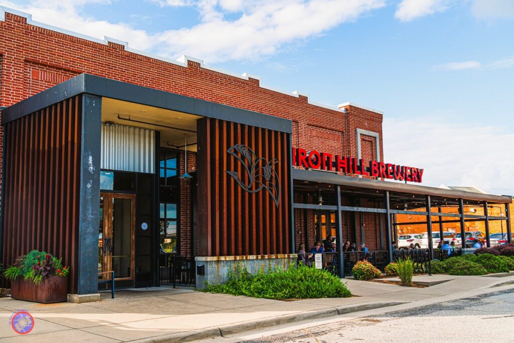 Special Food and Beverage Pairings - Up to the Hype? 100% 1 Exterior view of Iron Hill Brewery in Greenville, SC, a brick building with ironwork emphasizing the entry.