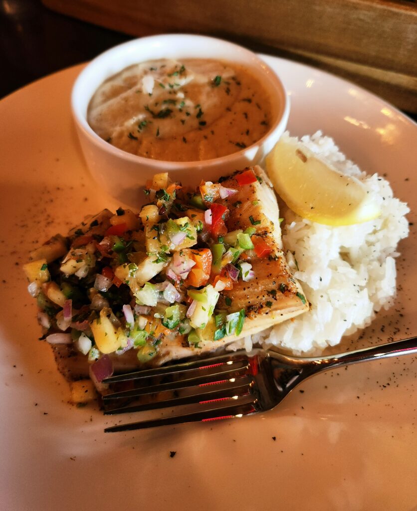 Mahi-Mahi Tropical, blackened mahi topped with pineapple salsa with jasmine rice and mashed cauliflower.