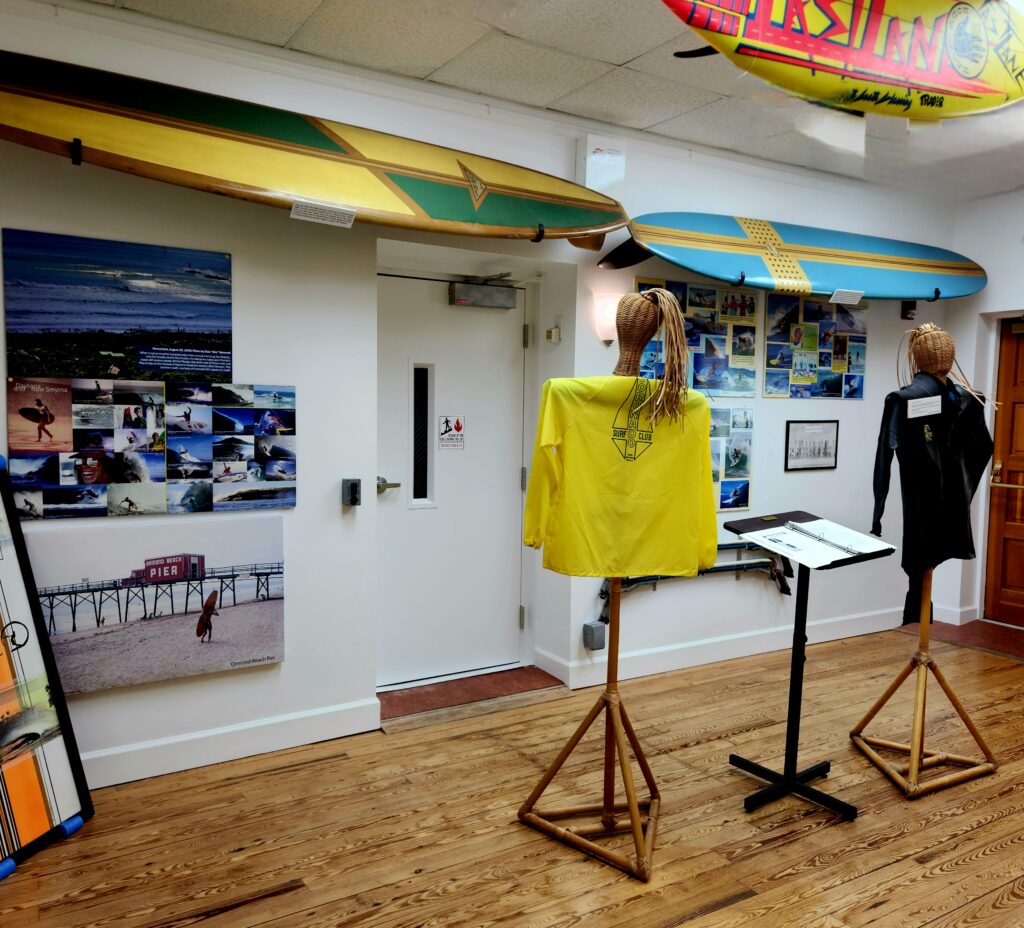 A display of surf boards and historic photos in the Surfing museum in New Smyrna Beach.