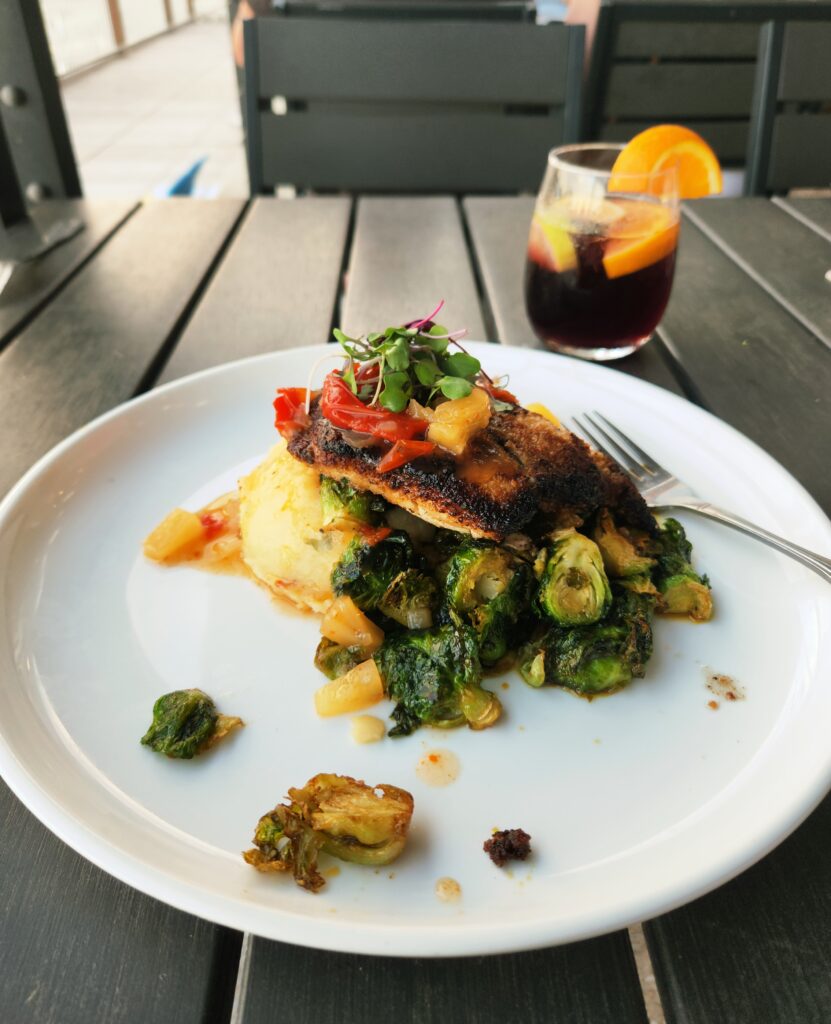 Walnut-encrusted snapper over roasted Brussels sprouts and creamy potatoes.