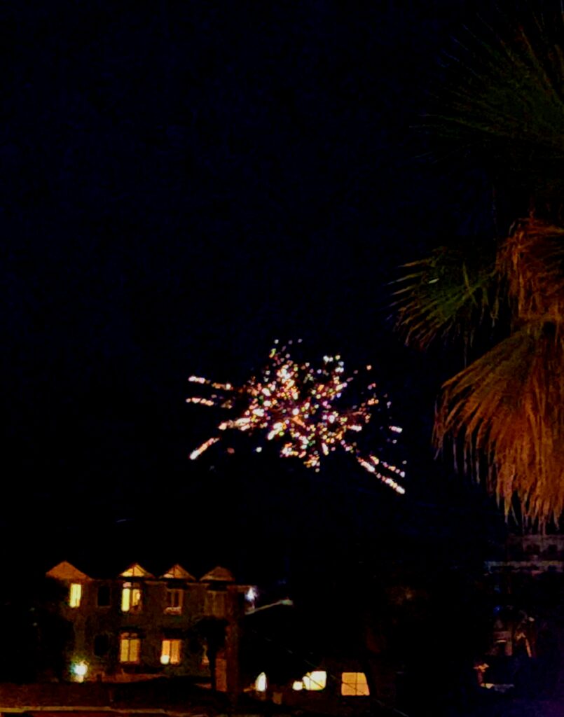 Private fireworks going off over New Smyrna Beach oceanfront condos.