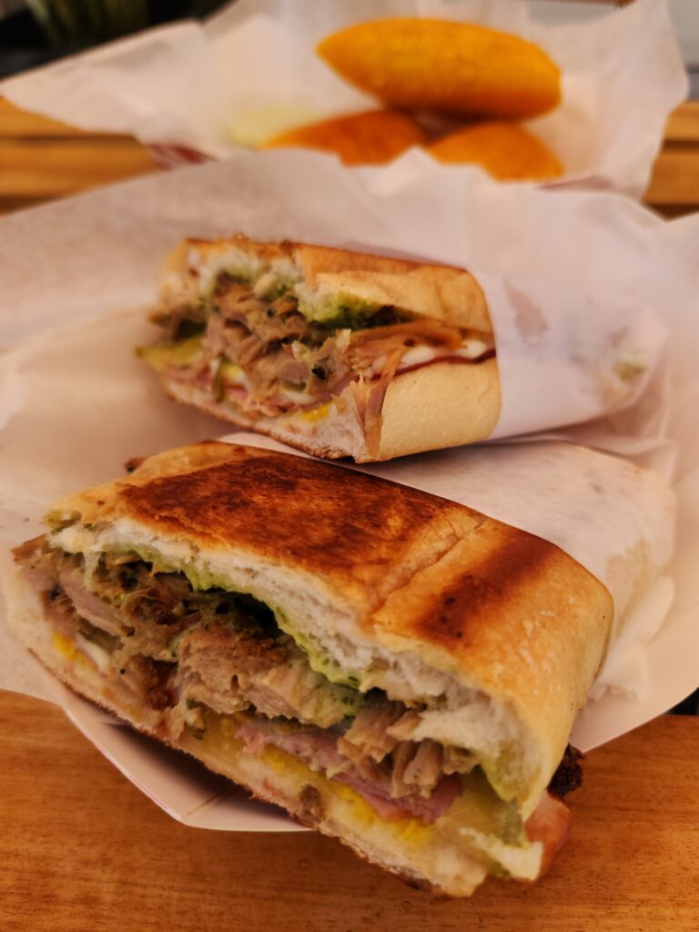 A fat Cuban sandwich wrapped in paper.