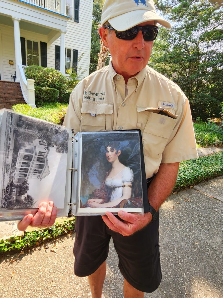 Man with photo album telling ghost stories.