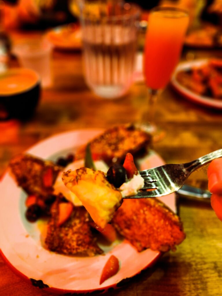 12 Ultimate Eating Stops in Buena Park and Santa Ana 40 A plate filled with Churro Waffles topped with strawberries and blueberries.