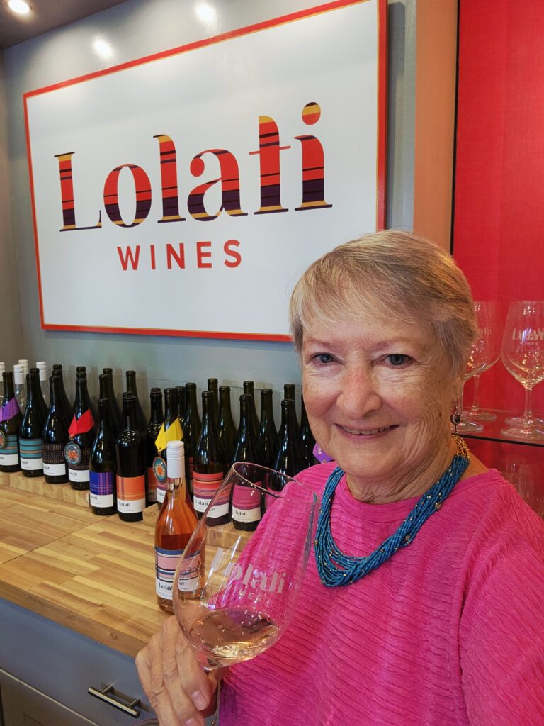 26 Sensational Must-Visit Oregon Wineries in the Willamette Valley 13 Jo with a glass of rose at Lolati's tasting bar.