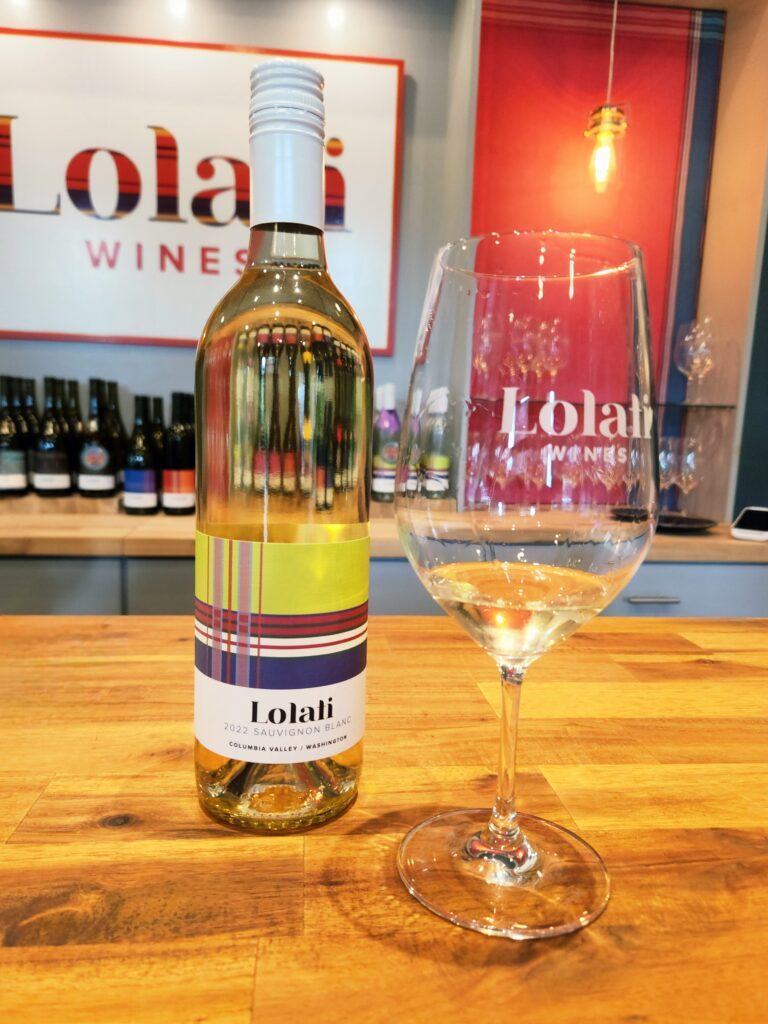 26 Sensational Must-Visit Oregon Wineries in the Willamette Valley 12 Bottle and glass of Lolati white wine.