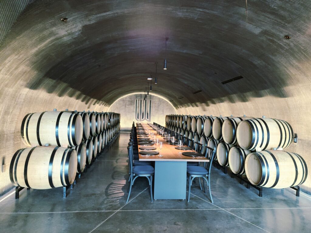 26 Sensational Must-Visit Oregon Wineries in the Willamette Valley 27 A cave filled with wine barrels in the Willamette Valley's Dundee Hills.