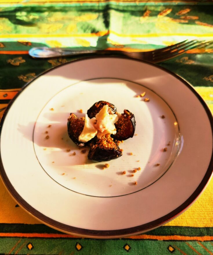 Fig quartered and topped with goat cheese.