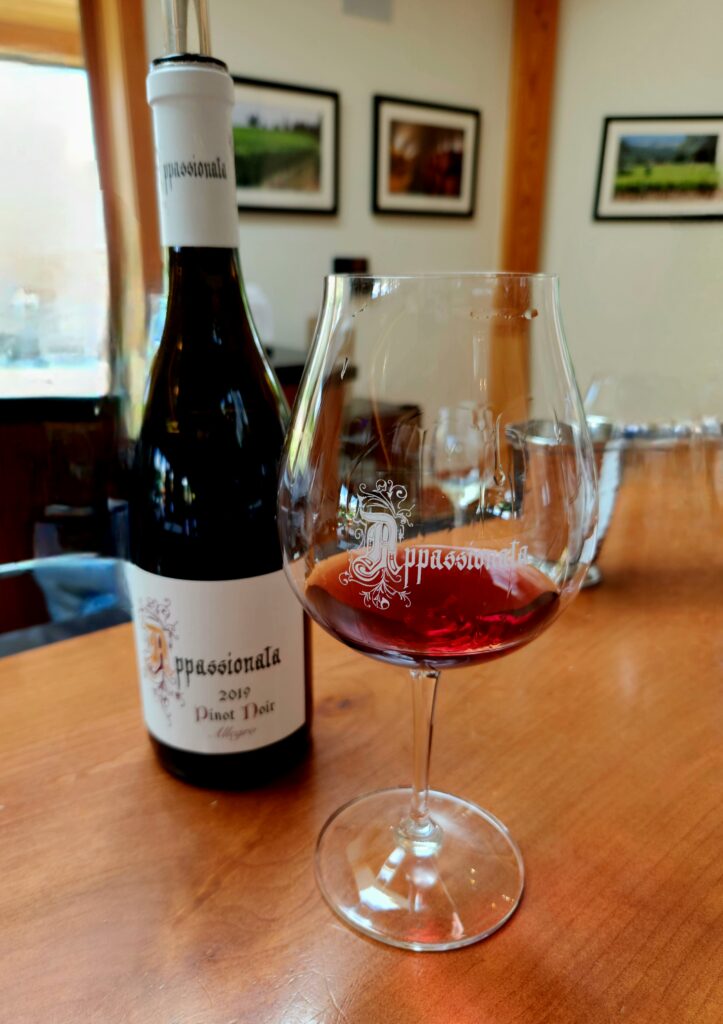26 Sensational Must-Visit Oregon Wineries in the Willamette Valley 38 A bottle and glass of Pinot Noir wine.