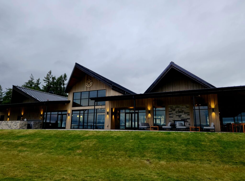 26 Sensational Must-Visit Oregon Wineries in the Willamette Valley 7 The beautiful back side of a winery with peaked roofs and lots of glass to see the view.