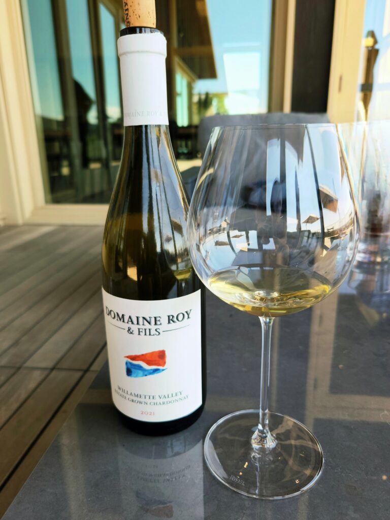 26 Sensational Must-Visit Oregon Wineries in the Willamette Valley 59 Bottle and glass of Chardonnay.
