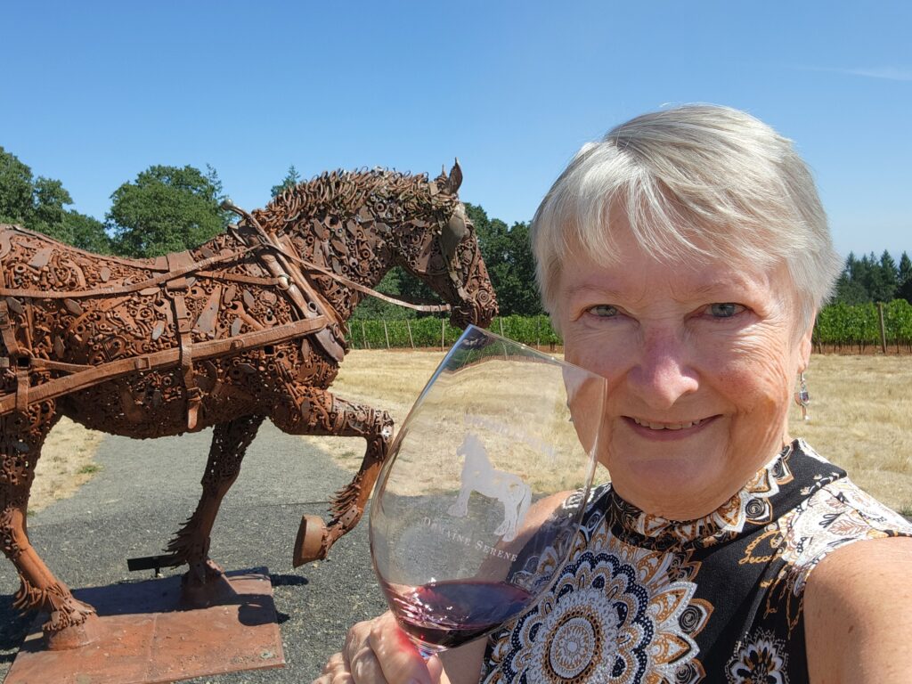 26 Sensational Must-Visit Oregon Wineries in the Willamette Valley 50 Metal sculpture of Cheval, a workhorse with the writer and her wine glass, picturing the same horse, filled with the Cheval wine.
