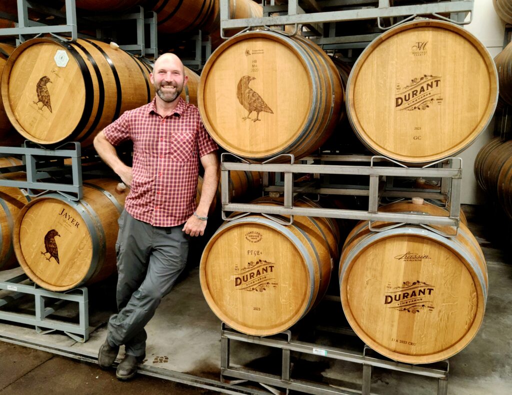 26 Sensational Must-Visit Oregon Wineries in the Willamette Valley 98 The winemaker leaning on the Durant barrels.
