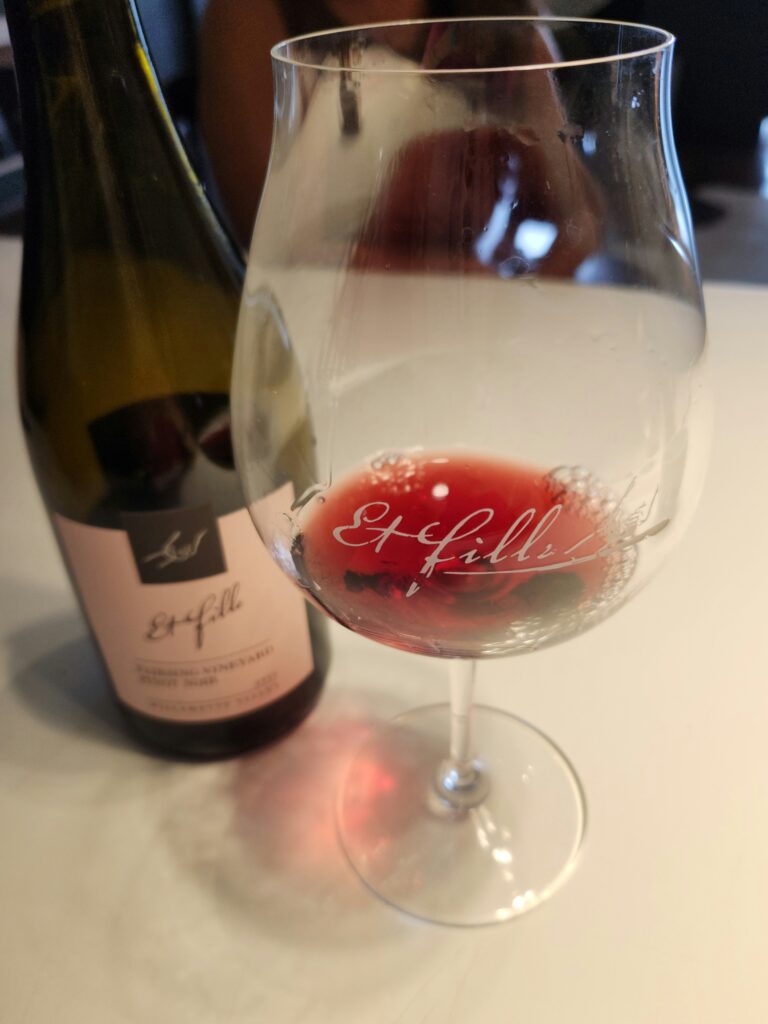 26 Sensational Must-Visit Oregon Wineries in the Willamette Valley 20 A bottle and wine glass of Et Fille Pinot Noir.