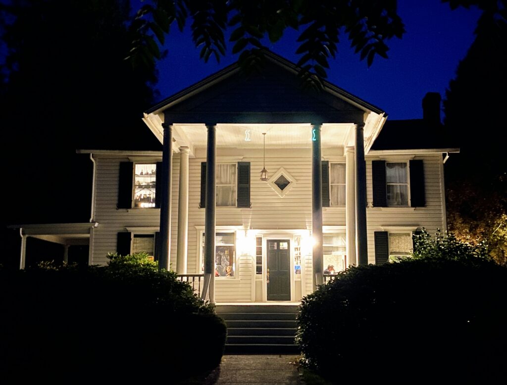 Spend 11 Awesome Days in the Willamette Valley 15 Large two-story white house, lit up at night.