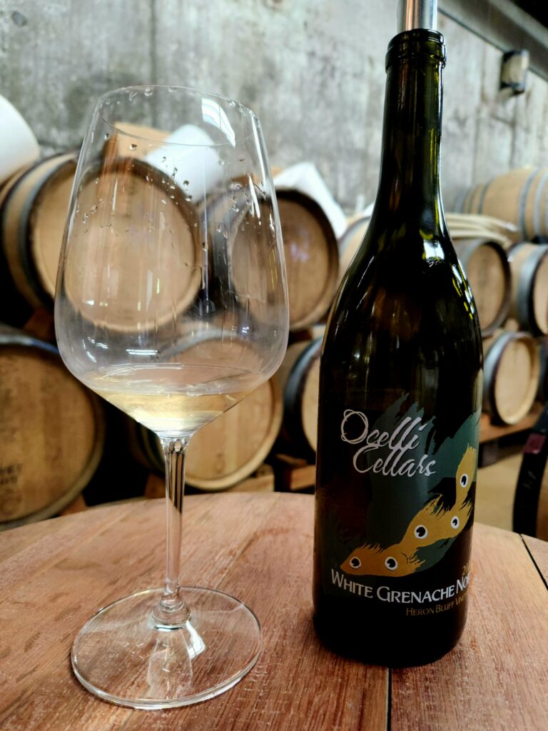 26 Sensational Must-Visit Oregon Wineries in the Willamette Valley 37 A glass and bottle of wine.
