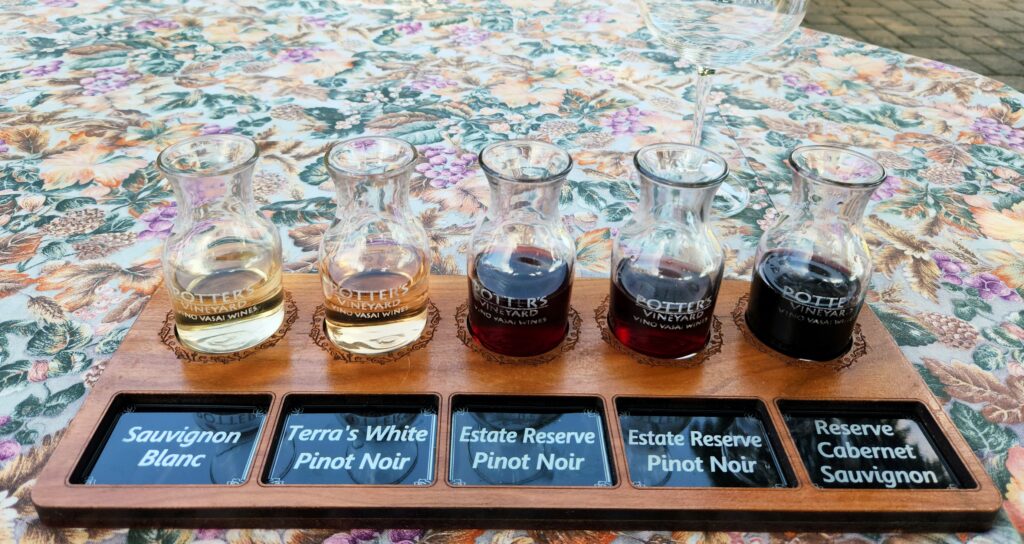 26 Sensational Must-Visit Oregon Wineries in the Willamette Valley 34 Small carafes of wine ready to pour for a tasting, with each labeled.