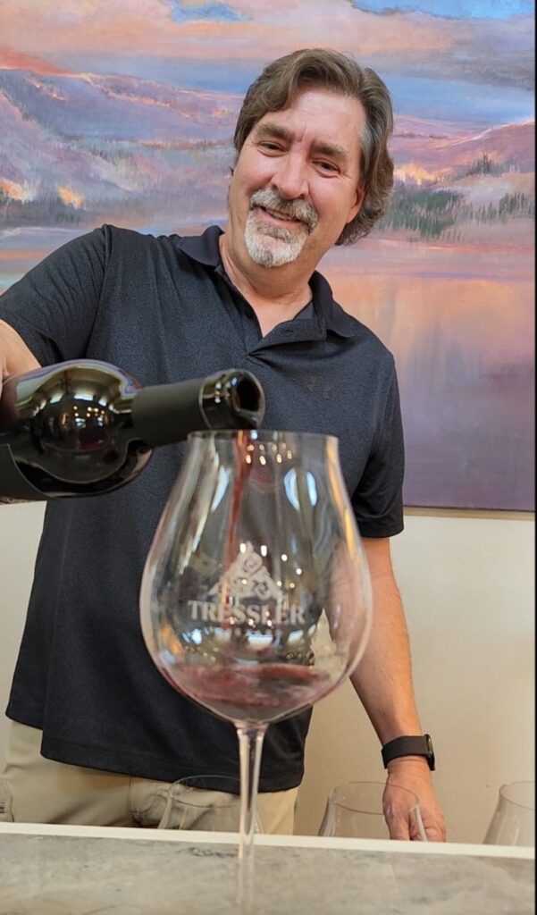 26 Sensational Must-Visit Oregon Wineries in the Willamette Valley 65 Winemaker pouring a glass of his red wine.
