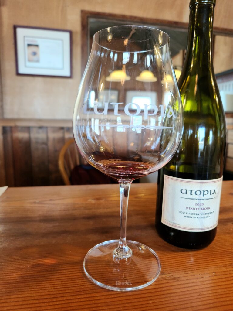 26 Sensational Must-Visit Oregon Wineries in the Willamette Valley 41 A glass of red wine and bottle of the wine.