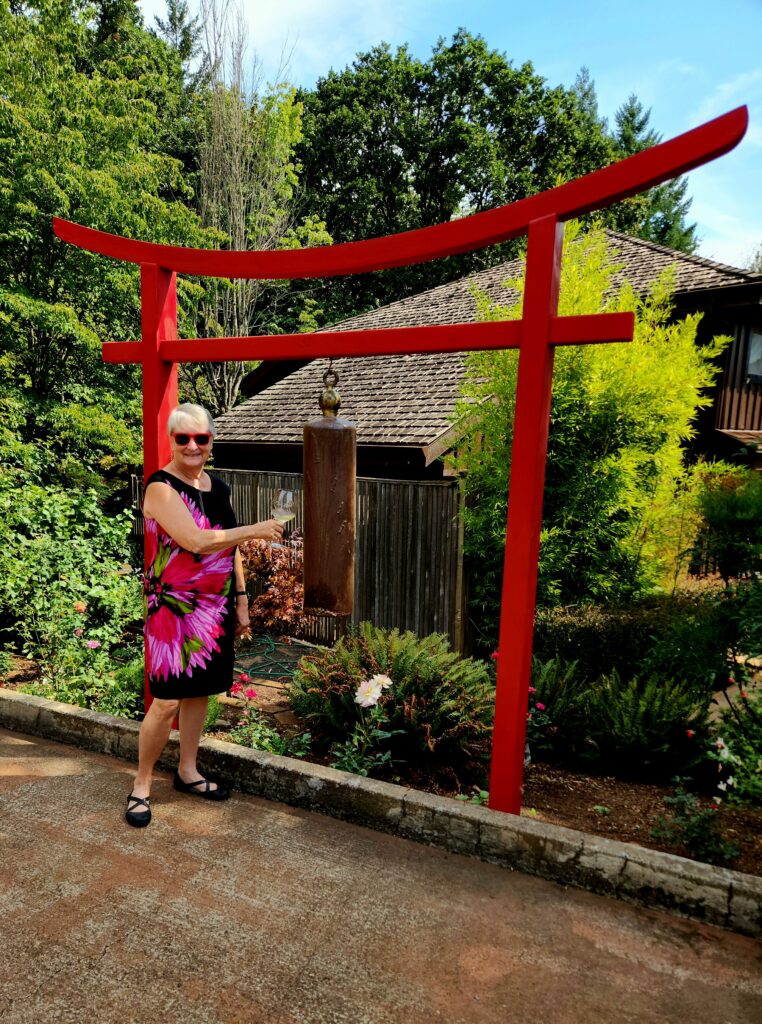 26 Sensational Must-Visit Oregon Wineries in the Willamette Valley 88 Writer, Jo, at the red Torii Mor Gate.