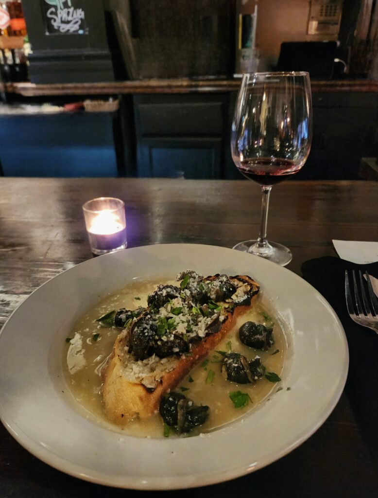 2 Islands, a Lighthouse, & Secret Magic of the Lowcountry 32 Escargot with toast on a white plate.