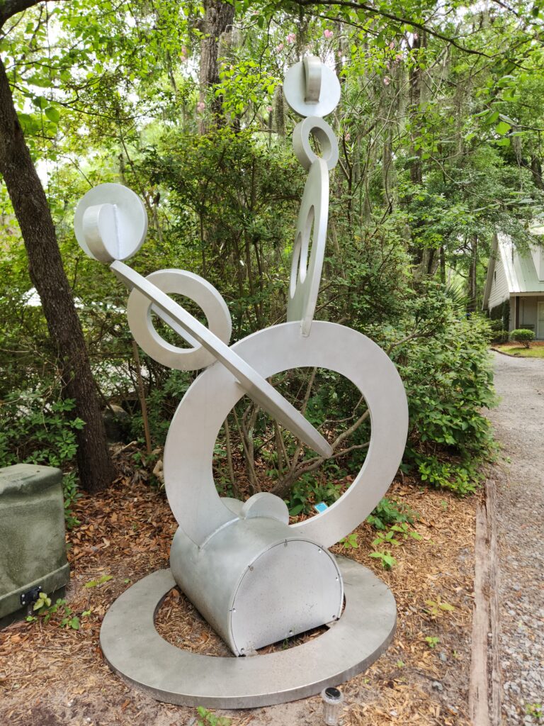 2 Islands, a Lighthouse, & Secret Magic of the Lowcountry 64 Interesting abstract sculpture by the driveway entrance.