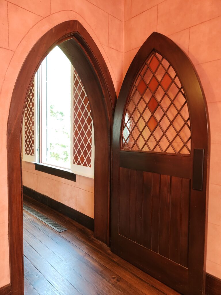 2 Islands, a Lighthouse, & Secret Magic of the Lowcountry 56 The rose glass in sanctuary windows and doors makes everything gleam.