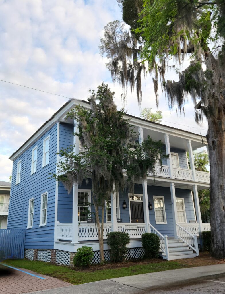 2 Islands, a Lighthouse, & Secret Magic of the Lowcountry 37 The Blue 2-story Guest house with front porches upstairs and down.