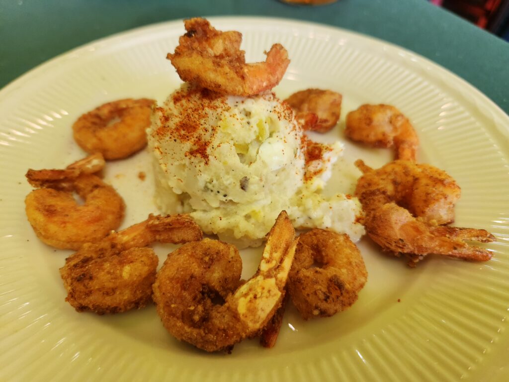 2 Islands, a Lighthouse, & Secret Magic of the Lowcountry 14 Fried shrimp and potato salad on a plate.