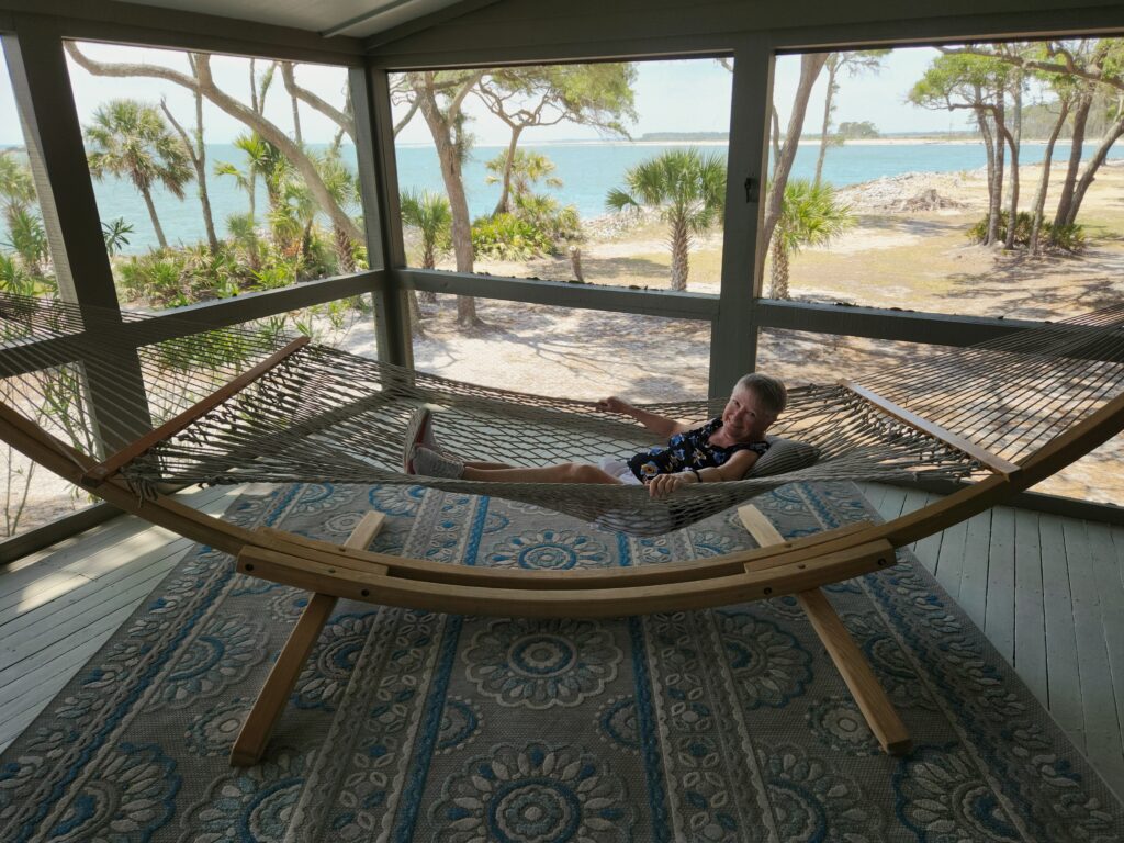 2 Islands, a Lighthouse, & Secret Magic of the Lowcountry 27 Writer, Jo, in hammock on porch of Ted Turner's Lowcountry island house.